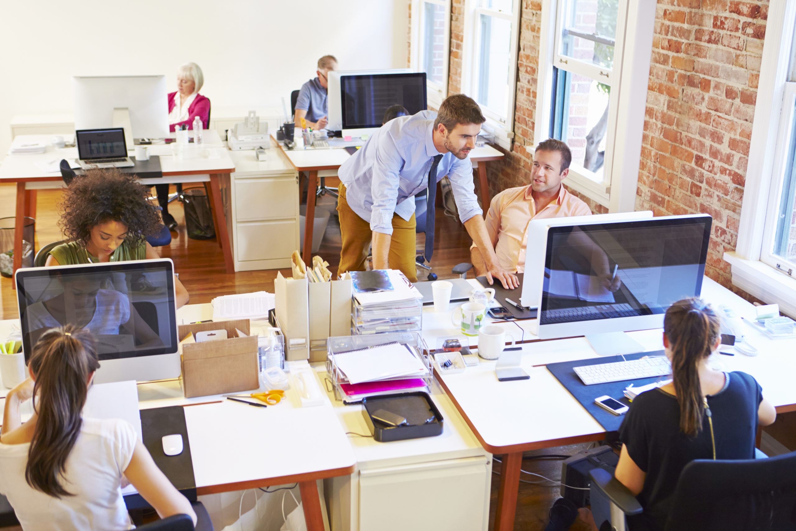 Wide Angle View Of Busy Design Office With Workers At Desks Black Line It